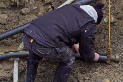 Contractor installing CARAPACE at outdoors job site