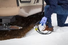 Contractor holding self-regulating low voltage heat trace system to install in RV